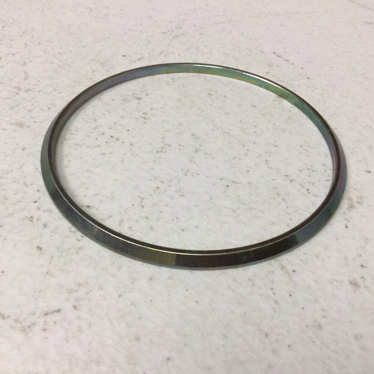 Airframe packing retaining ring